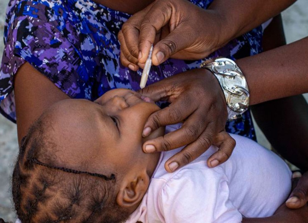 A young child is vaccinated against cholera in Haiti