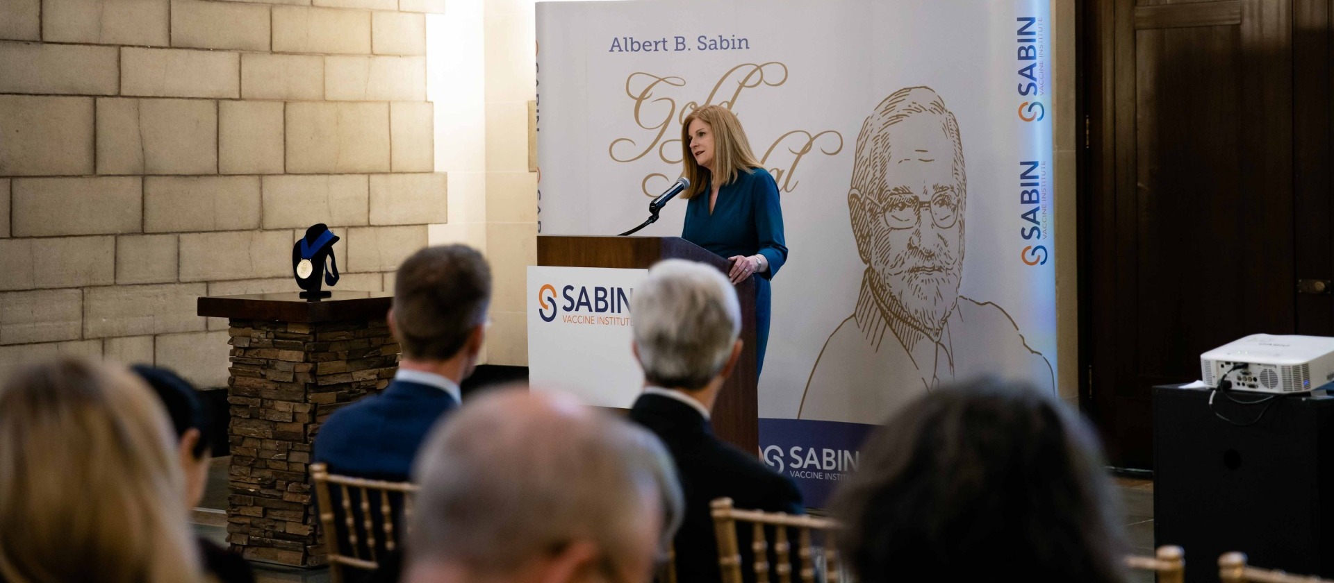 Amy Finan speaking at the Gold Medal Ceremony