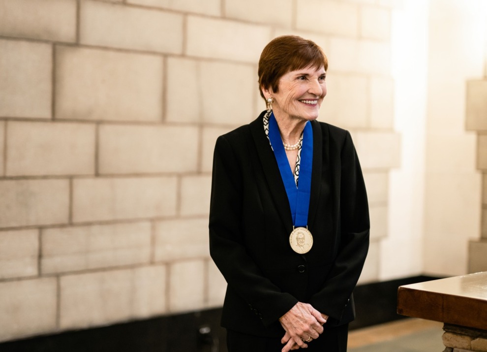 Dr. Carol Baker poses with the Gold Medal