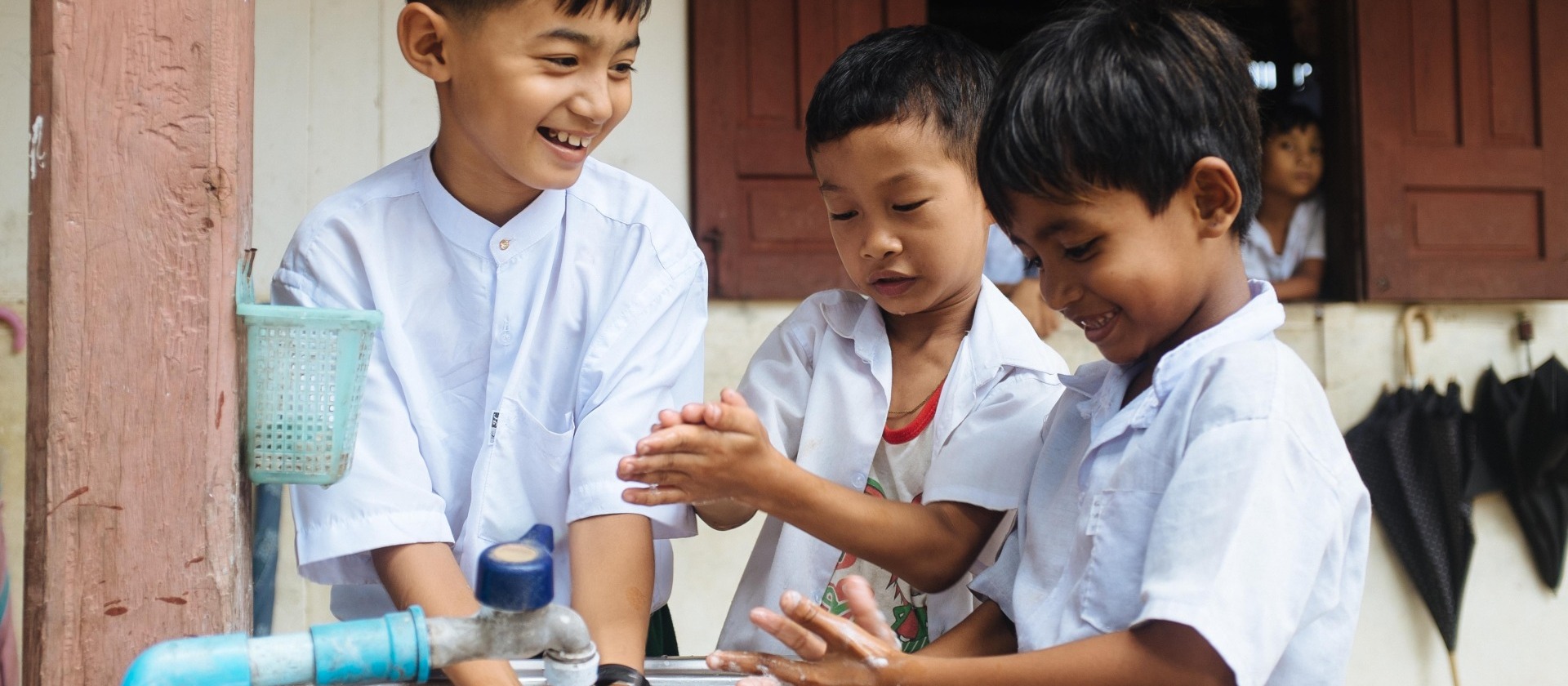 Children washing their hands