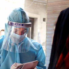 health-worker-in-PPE-house-visit