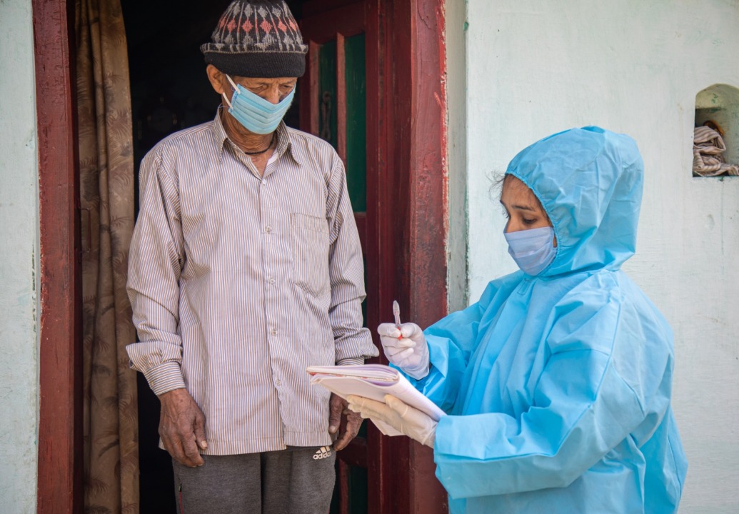 health-worker-performing-house-visit