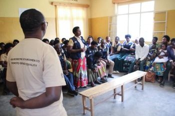 Man observing a group discussion