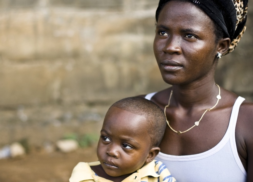 A woman and child looking off camera