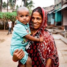 Mother-holding-child-in-village