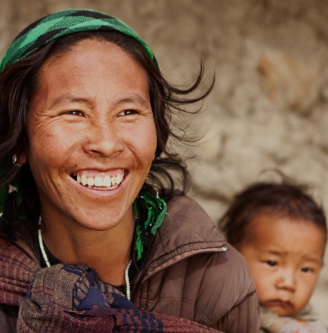 Woman smiling and holding child