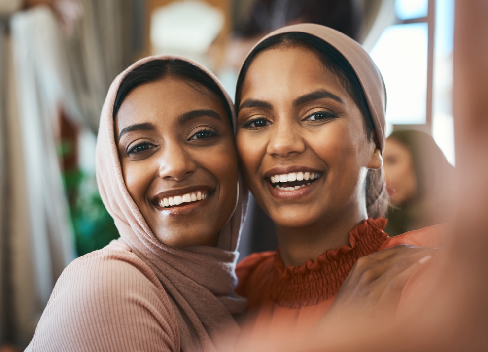Two women smiling at the camera