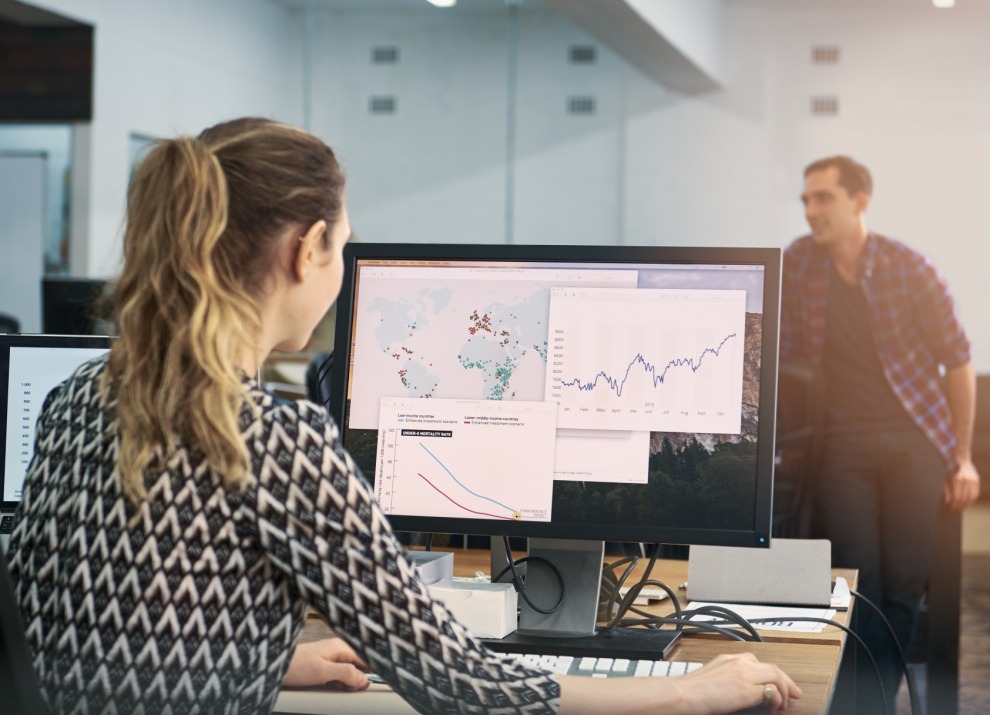 Woman reviewing data on computer