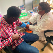 Doctor preparing a patients arm for a vaccination